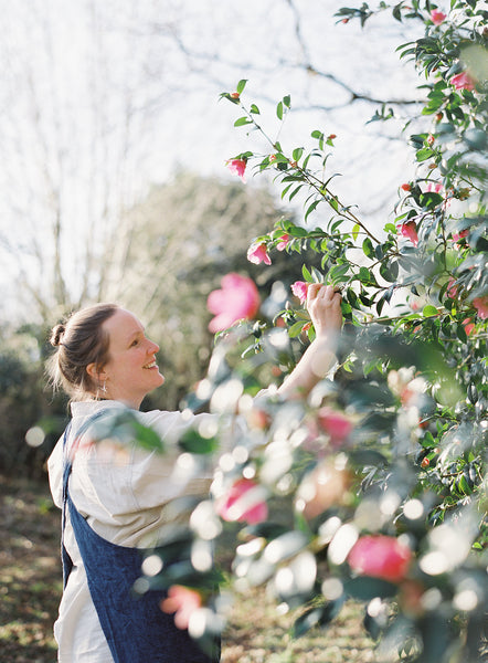 Naturally dyed silk ribbon and wedding dress collaboration with beautiful Cornish Camellias